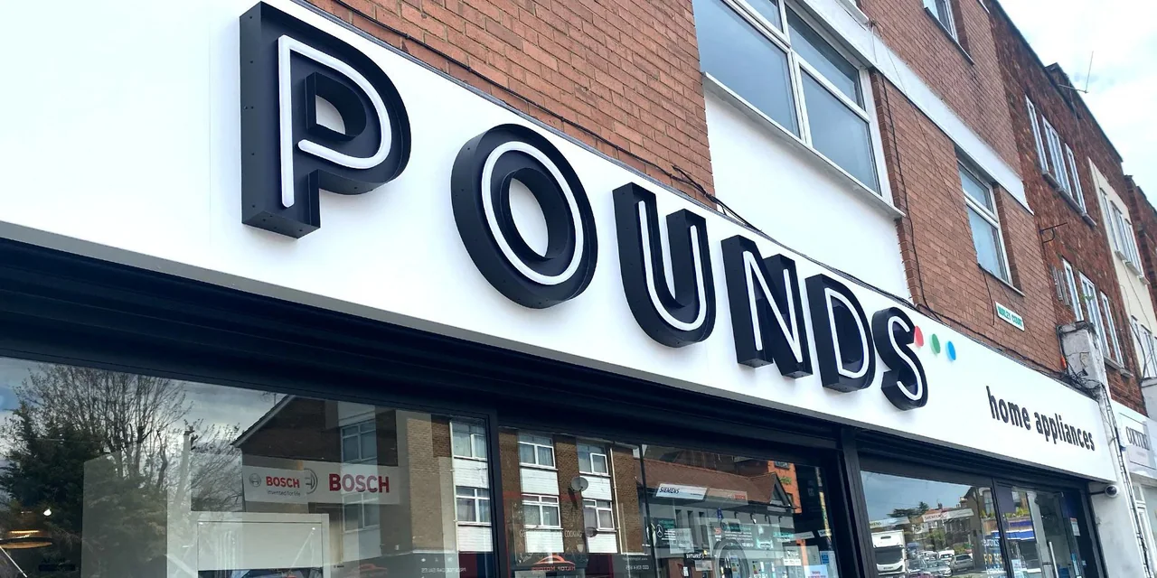 Dimensional store lettering above large retail display windows